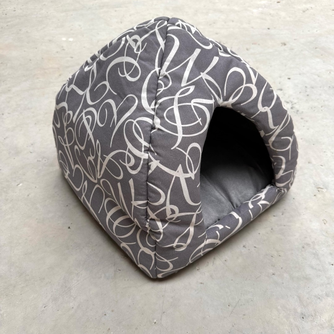 Luxury grey cat igloo bed with white swirl design and a removable cushion